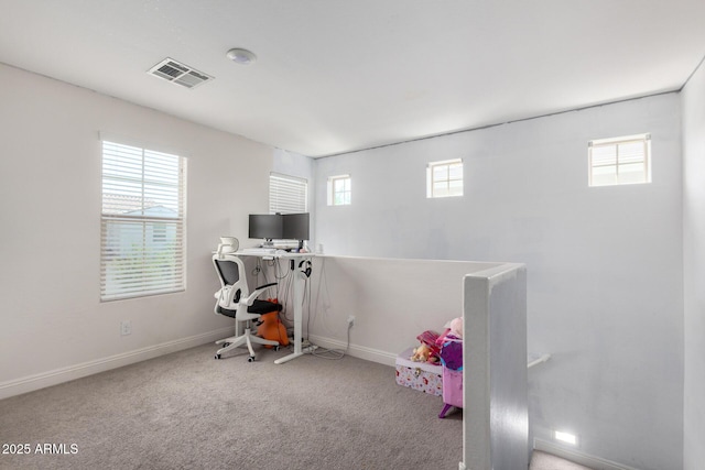 rec room featuring baseboards, a desk, and carpet floors