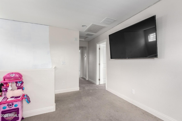 rec room with baseboards and carpet floors