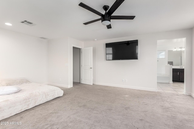 bedroom featuring carpet floors, baseboards, connected bathroom, ceiling fan, and recessed lighting