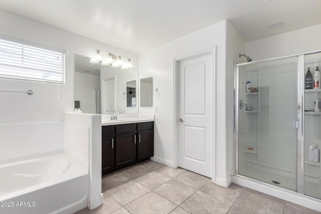 full bathroom featuring a stall shower, tile patterned flooring, vanity, and a bath