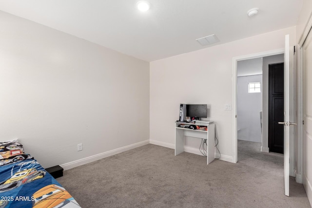 unfurnished bedroom featuring light carpet and baseboards