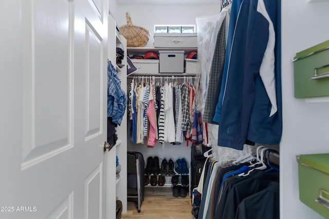 spacious closet featuring light wood-type flooring