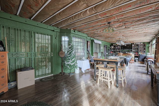 dining space with hardwood / wood-style floors