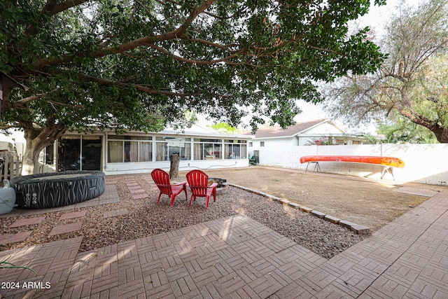 back of property featuring a sunroom and a patio