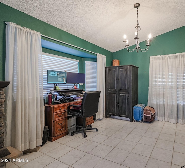 office space with light tile patterned flooring, a textured ceiling, and an inviting chandelier