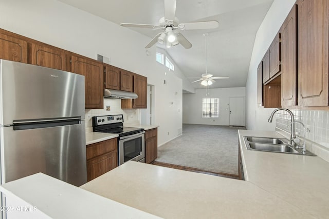 kitchen with sink, tasteful backsplash, kitchen peninsula, light colored carpet, and stainless steel appliances