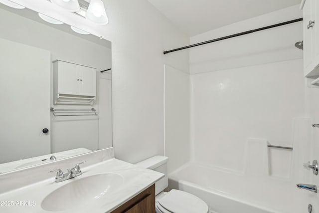 full bathroom with vanity, shower / bathtub combination, and toilet