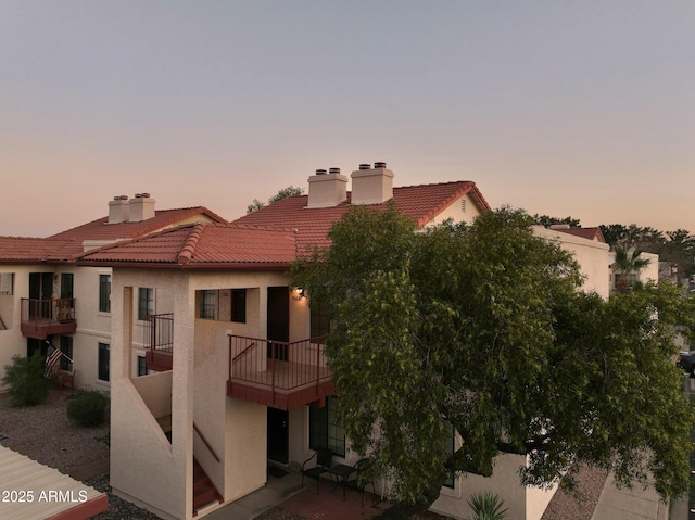 view of outdoor building at dusk