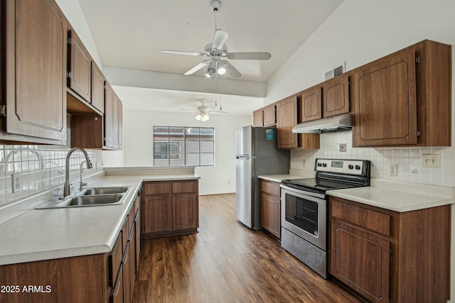 kitchen with sink, ceiling fan, appliances with stainless steel finishes, backsplash, and dark hardwood / wood-style flooring