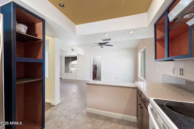 kitchen with ceiling fan and light tile patterned flooring