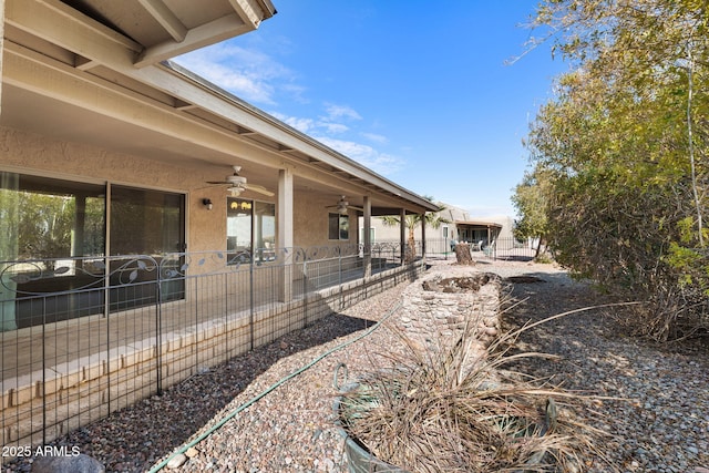 view of yard featuring ceiling fan