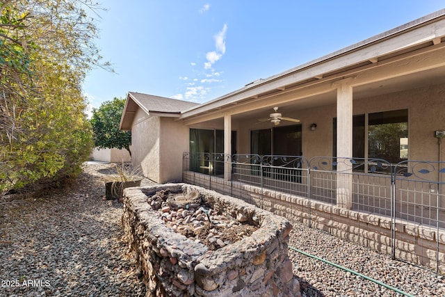 view of home's exterior with ceiling fan