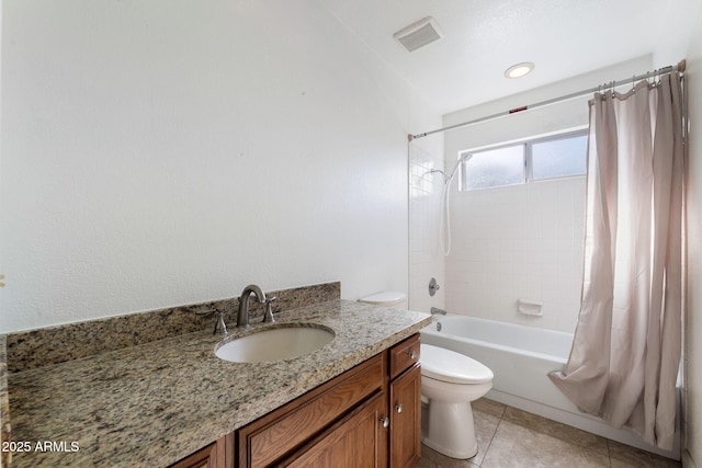 full bathroom featuring vanity, tile patterned floors, toilet, and shower / tub combo with curtain