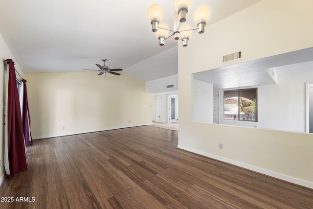 unfurnished living room featuring ceiling fan with notable chandelier, dark wood-type flooring, and vaulted ceiling