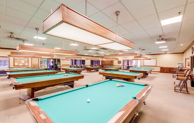 rec room with light carpet, a paneled ceiling, billiards, and ceiling fan