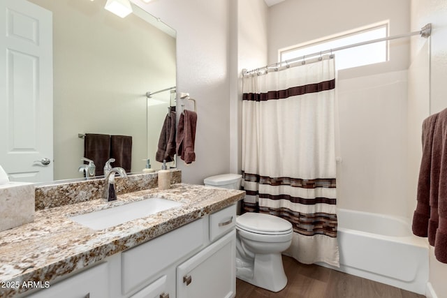 full bathroom featuring shower / tub combo, toilet, wood finished floors, and vanity