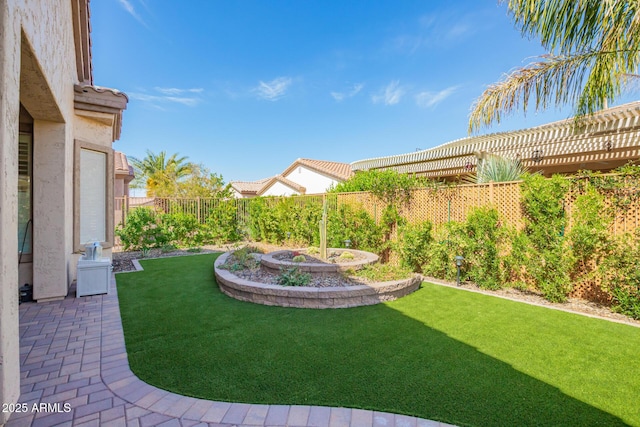view of yard featuring a pergola and a fenced backyard
