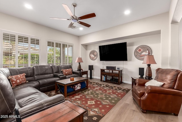 living area featuring a ceiling fan, recessed lighting, wood finished floors, and visible vents