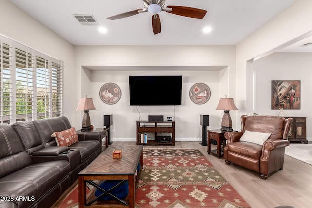 living room with visible vents, baseboards, ceiling fan, recessed lighting, and wood finished floors