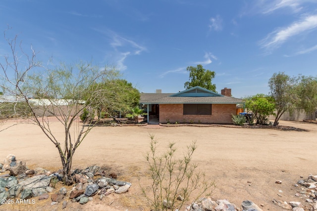 18049 N 13th Ave, Phoenix, AZ 85023 - ranch-style house featuring a chimney and brick siding