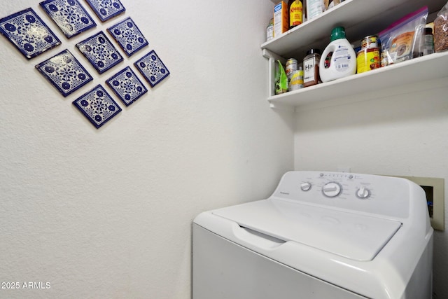 laundry area featuring washer / dryer and laundry area