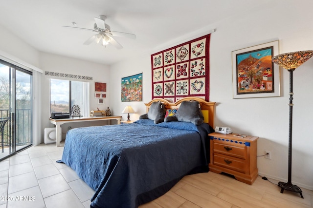 bedroom featuring ceiling fan, access to outside, and baseboards