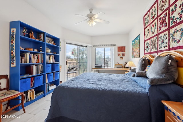 bedroom with ceiling fan and access to outside