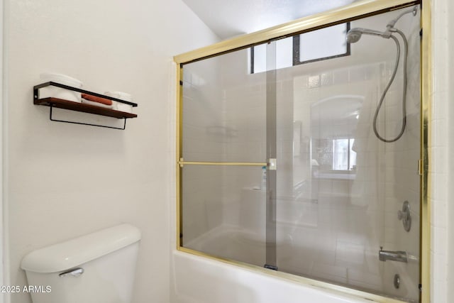 full bathroom with shower / bath combination with glass door and toilet