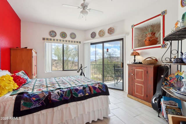 bedroom with access to exterior and a ceiling fan