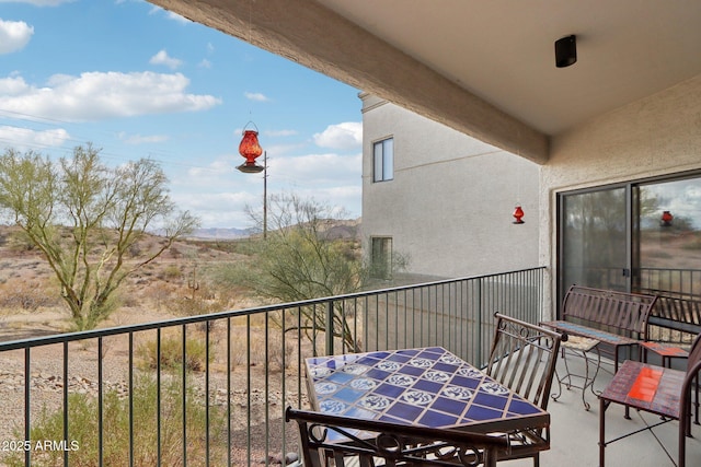 balcony with outdoor dining area