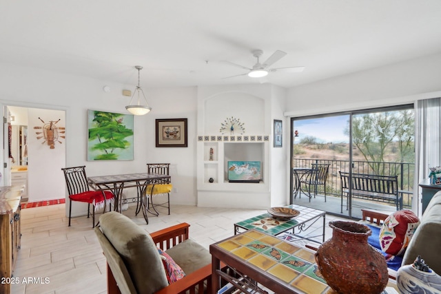 living area with ceiling fan