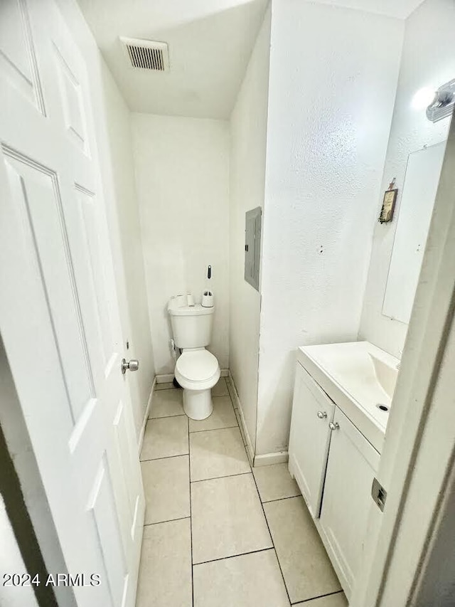 3840 N 43rd Ave Unit 29, Phoenix, AZ 85031 - bathroom featuring tile patterned flooring, vanity, electric panel, and toilet