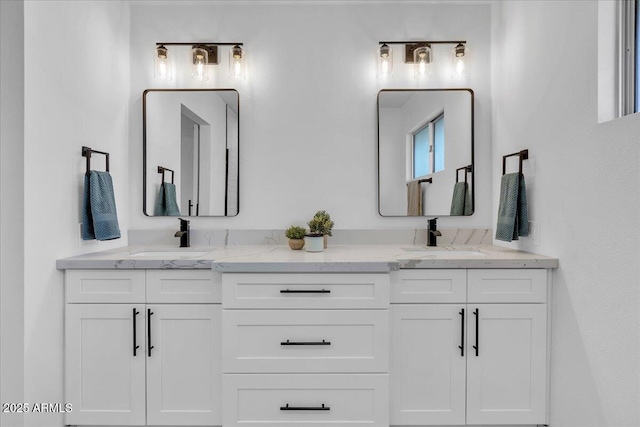 bathroom with double vanity and a sink