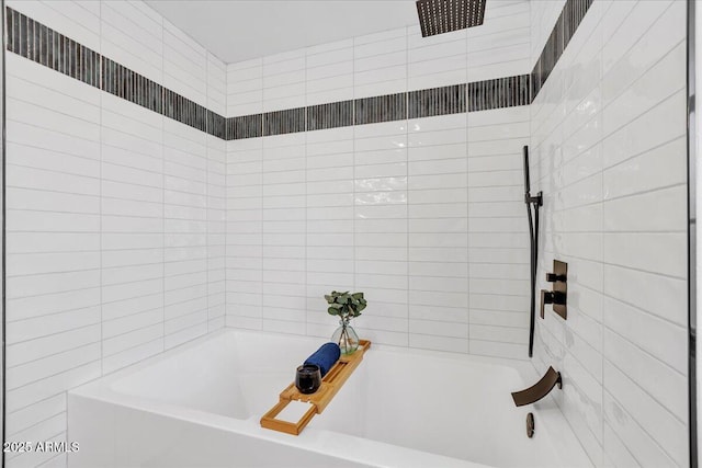 bathroom featuring a tub to relax in and walk in shower