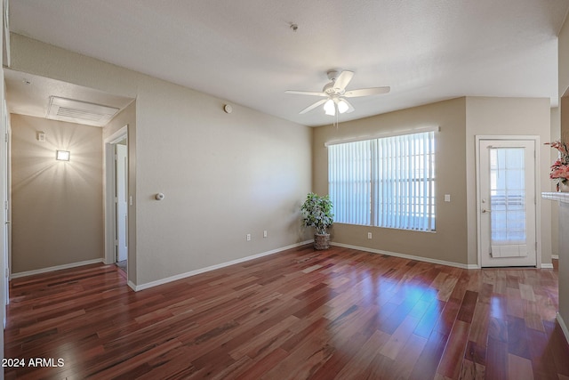 14950 W Mountain View Blvd Unit 1310, Surprise, AZ 85374 - unfurnished room with ceiling fan, wood finished floors, healthy amount of natural light, and baseboards