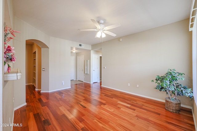 unfurnished room featuring hardwood / wood-style flooring and ceiling fan