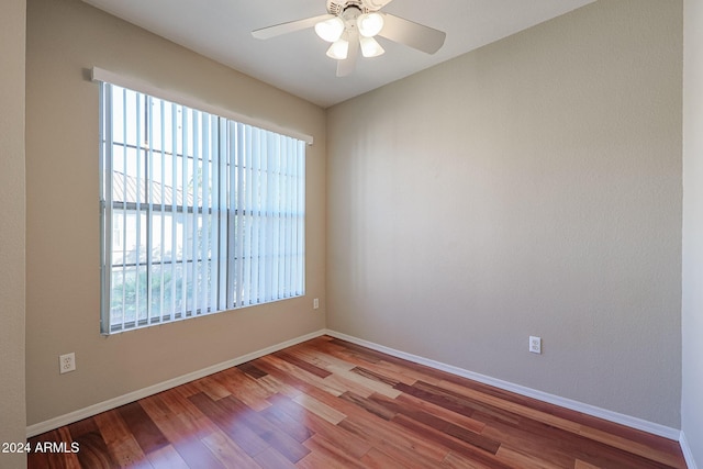 spare room featuring ceiling fan and hardwood / wood-style flooring