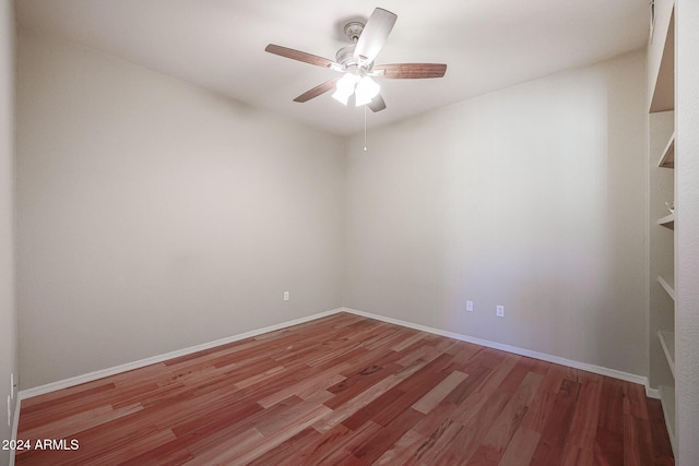 14950 W Mountain View Blvd Unit 1310, Surprise, AZ 85374 - empty room featuring a ceiling fan, wood finished floors, and baseboards