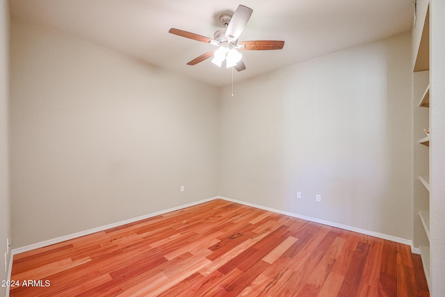 empty room featuring light wood-type flooring and ceiling fan