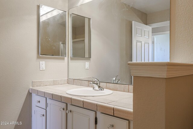 14950 W Mountain View Blvd Unit 1310, Surprise, AZ 85374 - bathroom with vanity and a textured wall