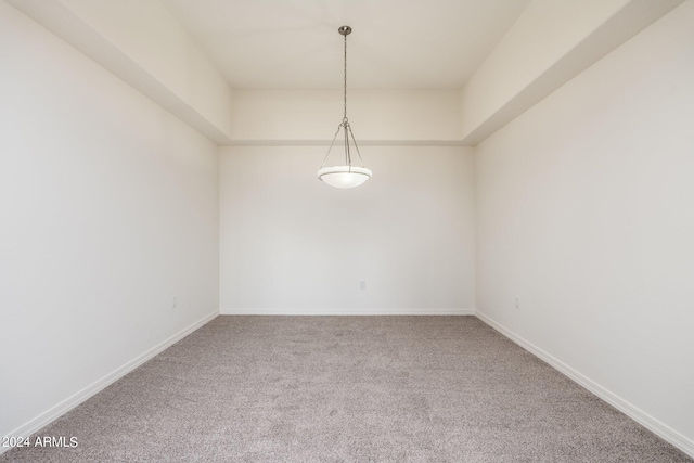 unfurnished room featuring carpet