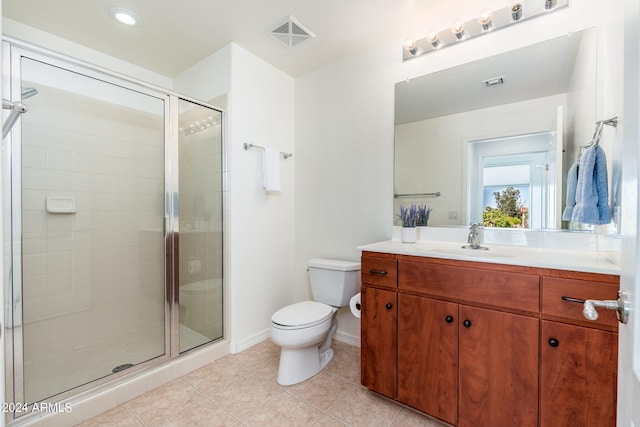 bathroom with walk in shower, toilet, tile flooring, and vanity