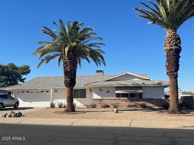 single story home with a garage and concrete driveway