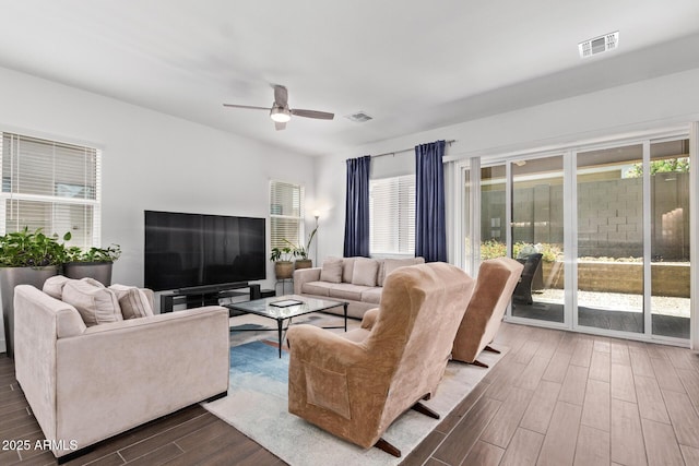 939 E Paseo Way, Phoenix, AZ 85042 - living area featuring dark wood-type flooring and ceiling fan
