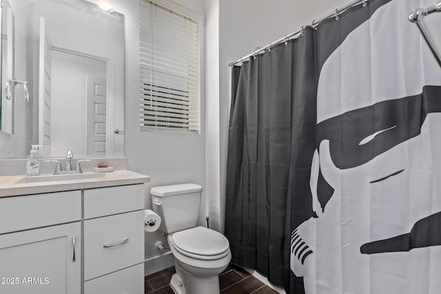 939 E Paseo Way, Phoenix, AZ 85042 - bathroom featuring vanity, toilet, and wood tiled floors