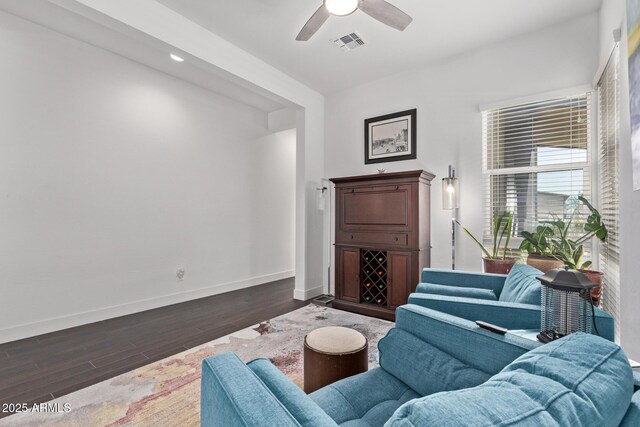 939 E Paseo Way, Phoenix, AZ 85042 - living room with dark wood-type flooring, baseboards, and a ceiling fan