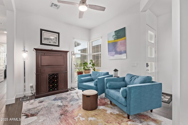 939 E Paseo Way, Phoenix, AZ 85042 - sitting room with a ceiling fan, wood finished floors, and baseboards