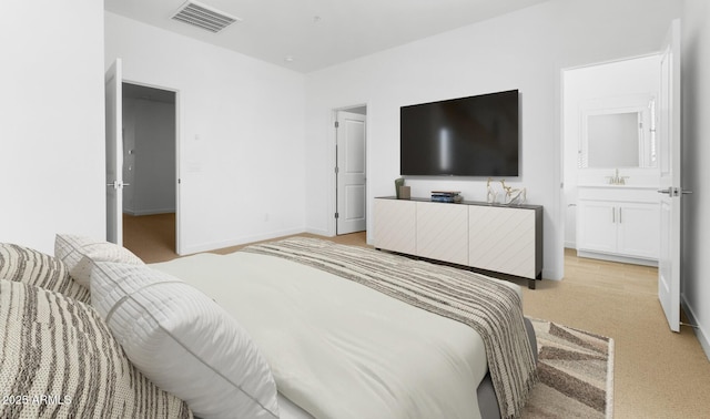 bedroom featuring light carpet, visible vents, and baseboards