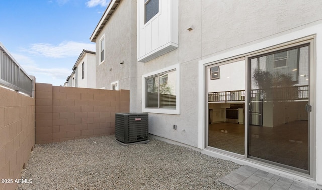 view of patio with fence and central air condition unit