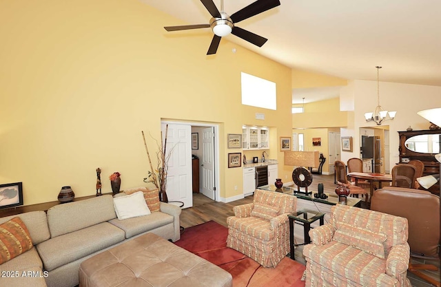 9235 N 101st St, Scottsdale, AZ 85258 - living room featuring wine cooler, a chandelier, wood finished floors, a ceiling fan, and high vaulted ceiling